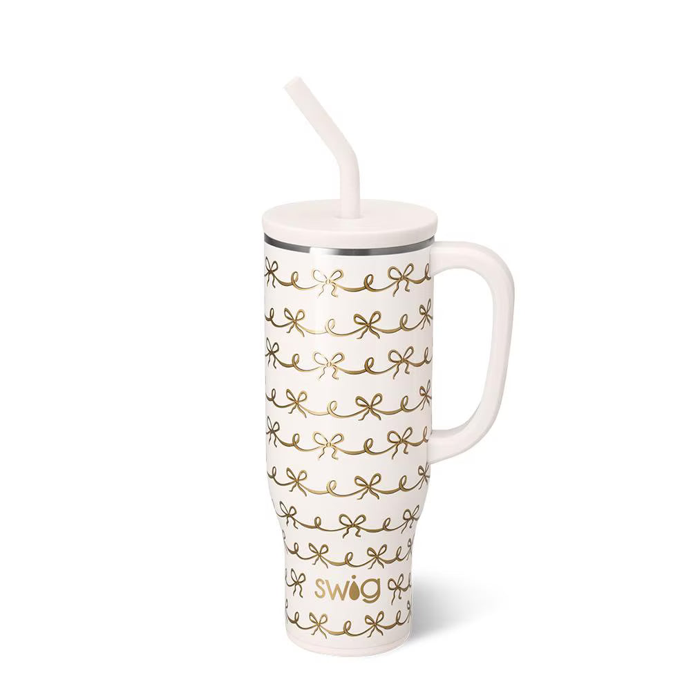 Glitter ivory 30oz mega mug with gold bow design, comfort-grip handle, and straw lid by Swig Life