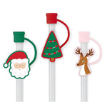 Three reusable straws with holiday silicone toppers—Santa, Christmas tree, and reindeer—with protective caps