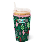 Large neoprene iced cup coolie in green with holly and mistletoe pattern, pink trim, and Swig logo