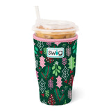 Large neoprene iced cup coolie in green with holly and mistletoe pattern, pink trim, and Swig logo