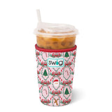 Medium neoprene iced drink sleeve with pink background, Christmas icons, and red trim, holding iced coffee