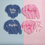 Set of matching pink and blue sibling sweaters and sweater bubbles labeled Baby Bro, Big Bro, Baby Sis, and Big Sis