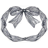 Die-cut paper placemat featuring black striped bow on white background
