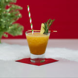 Blitzen Bourbon holiday slush mix pouch with cocktail glass by fireplace.