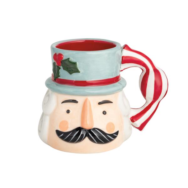 Blue ceramic nutcracker mug with candy cane–striped handle and hand-painted details.