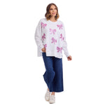 White oversized sweatshirt with pink sequin bow appliqués