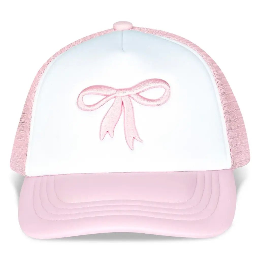 White and pink bow trucker hat with embroidered bow detail, mesh back, and adjustable strap.