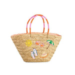 Woven beach bag with colorful handles and embroidered designs on a white background