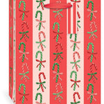 Punch Studio Candy Cane Lane Large Vertical Premium Gift Bag with embossed candy cane pattern and red grosgrain handle.