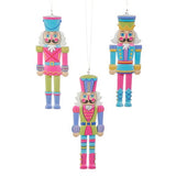Set of three 6-inch multicolor Candy Shop Nutcracker cut out ornaments designed by Haley Bush.