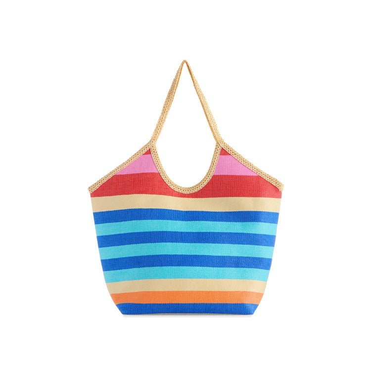 Colorful striped bag with a gold trim on a white background