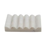 White carved marble soap dish with grooved design
