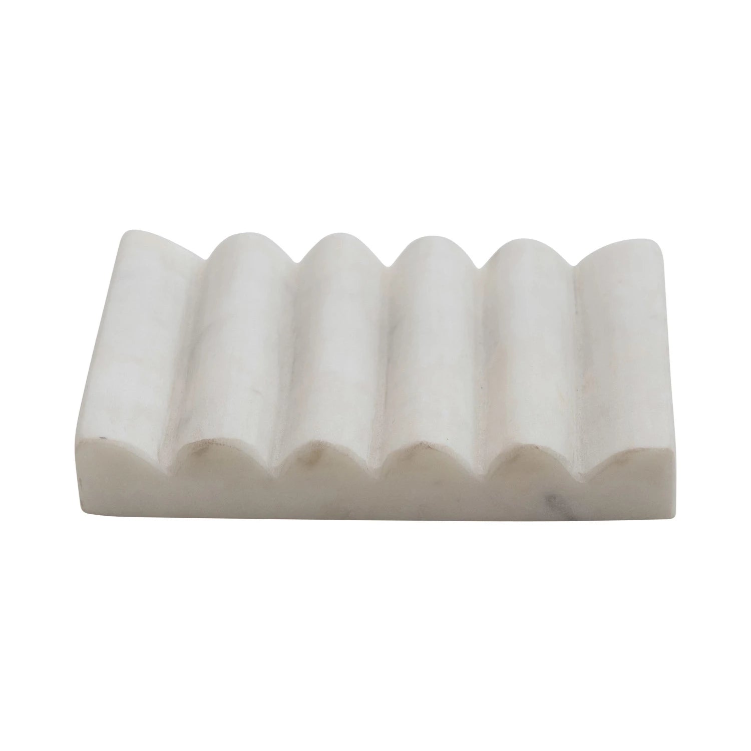 White carved marble soap dish with grooved design