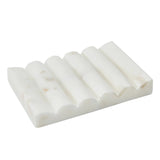 White carved marble soap dish with grooved design