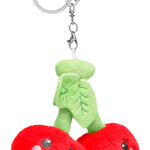 Plush cherries keychain with smiling embroidered faces and green leaf topper, attached to silver clip.
