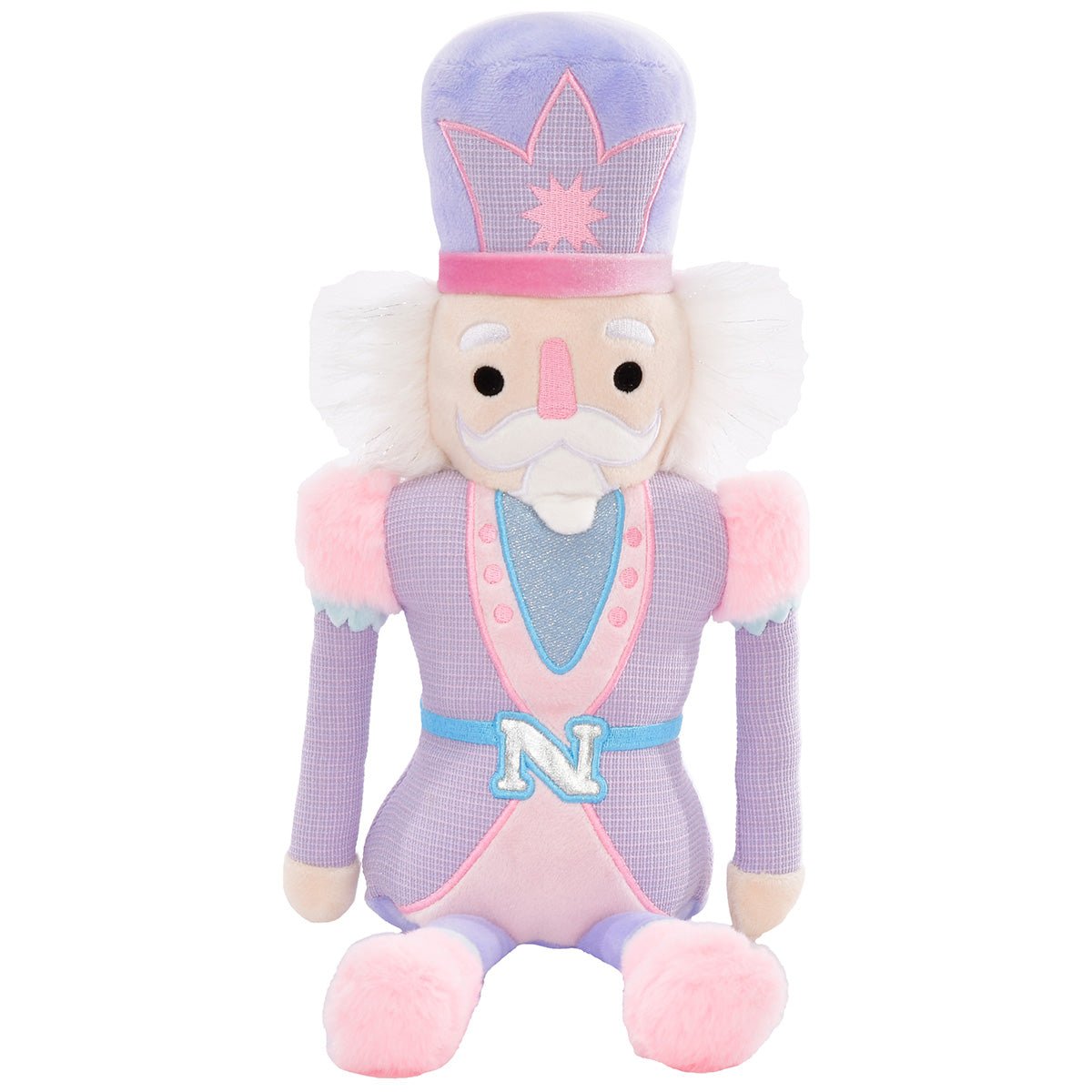 Pastel Nutcracker plush toy in pink, purple, and blue with faux fur trim, metallic accents, and embroidered details.