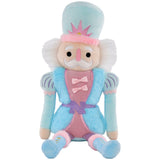 Chris Nutcracker plush toy in pastel blue and pink with faux fur, glitter accents, and embroidered details.