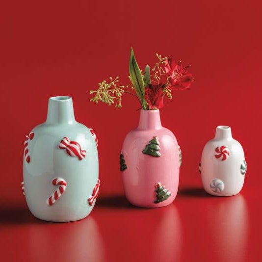 Light blue ceramic vase with red and white candy cane and peppermint accents.