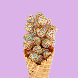 Waffle cone filled with colorful ice cream balls on a purple background