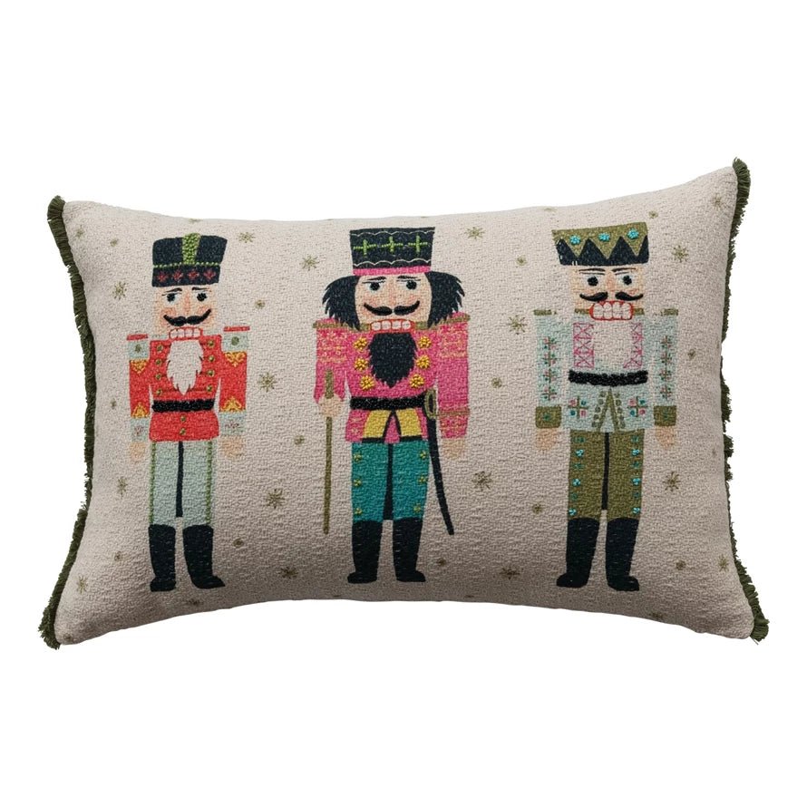 Rectangular holiday pillow with three colorful nutcrackers and beaded accents