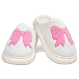 Children’s Cozy Bow slippers made of chenille with pink embroidered bow design and skid-resistant sole.