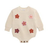 Cream knit baby sweater bubble with crochet daisies and button leg closure