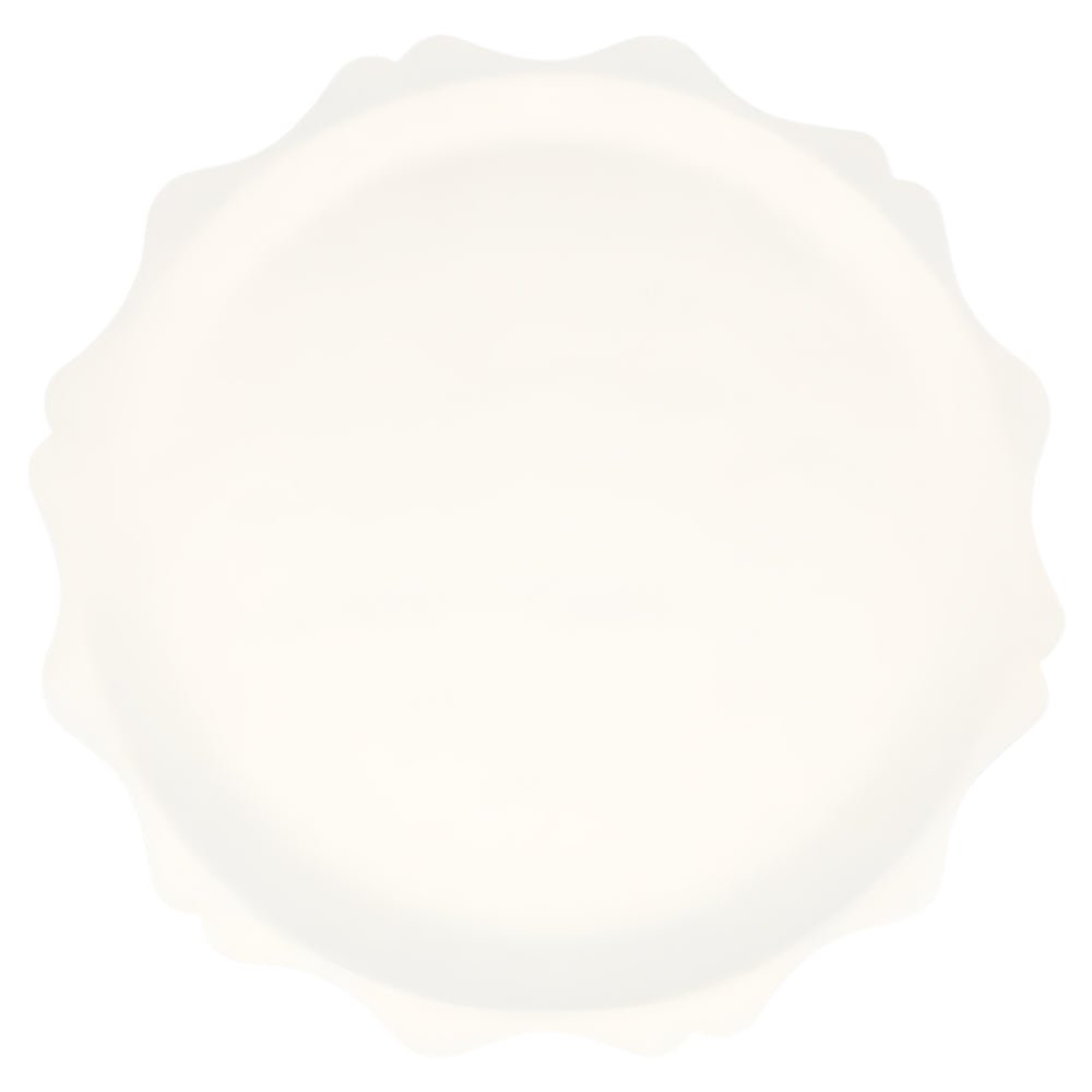 Large white compostable party plate with wavy edge, made from bamboo and sugarcane pulp