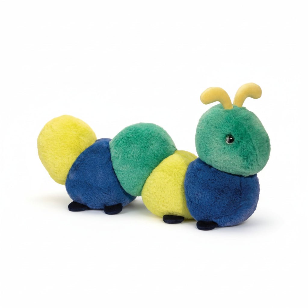 Plush toy caterpillar with green, blue, and yellow segments on a white background