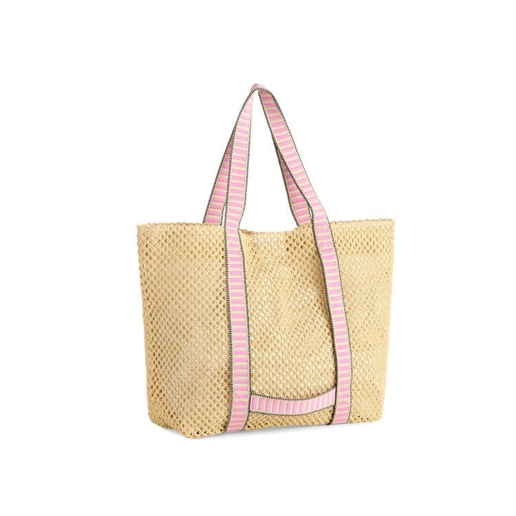 Woven tote bag with pink striped handles on a white background