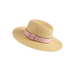 Beige straw hat with a pink and black striped band on a white background
