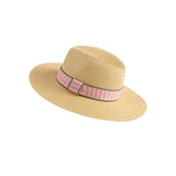 Beige straw hat with a pink and black striped band on a white background