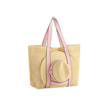 Beige straw tote bag with pink straps on a white background