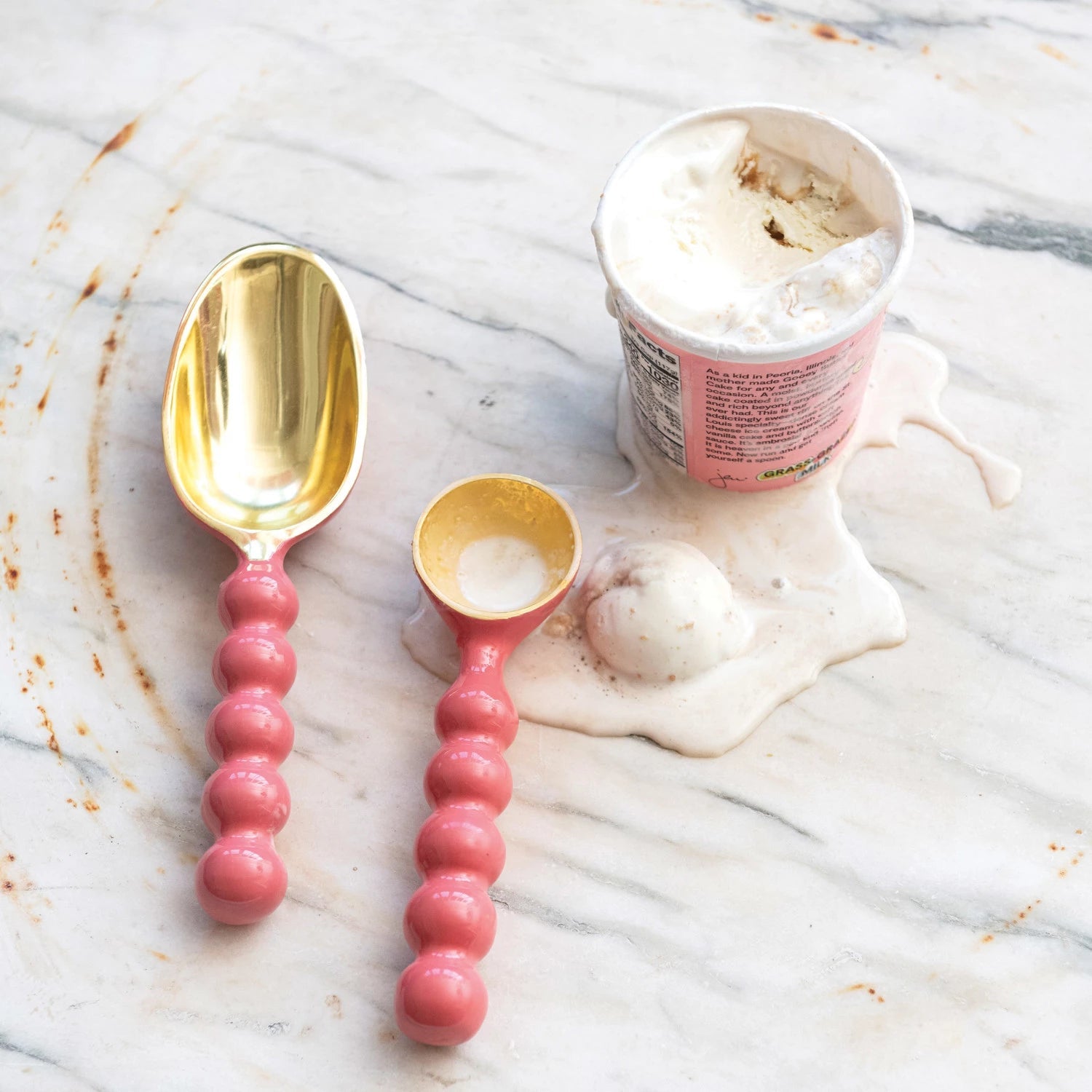 Pink and gold enameled aluminum ice cream scoop with round ball handle