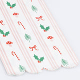 Christmas paper guest towel with red and green holiday icons and pink stripes