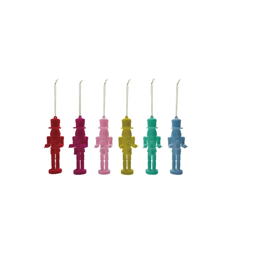 Set of six colorful flocked soldier ornaments in bright rainbow colors