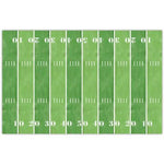 Green rectangular placemat designed like a football field with white yard lines and numbers