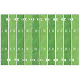 Green rectangular placemat designed like a football field with white yard lines and numbers