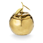 Gilded Citrus candle in a shiny gold apple-shaped jar with sculpted leaves