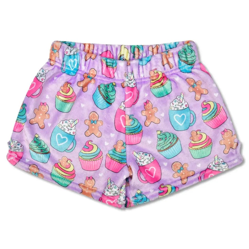 Children’s Gingerbread Cafe plush shorts with pastel holiday print of cupcakes, hot cocoa mugs, and gingerbread cookies on lavender fabric.