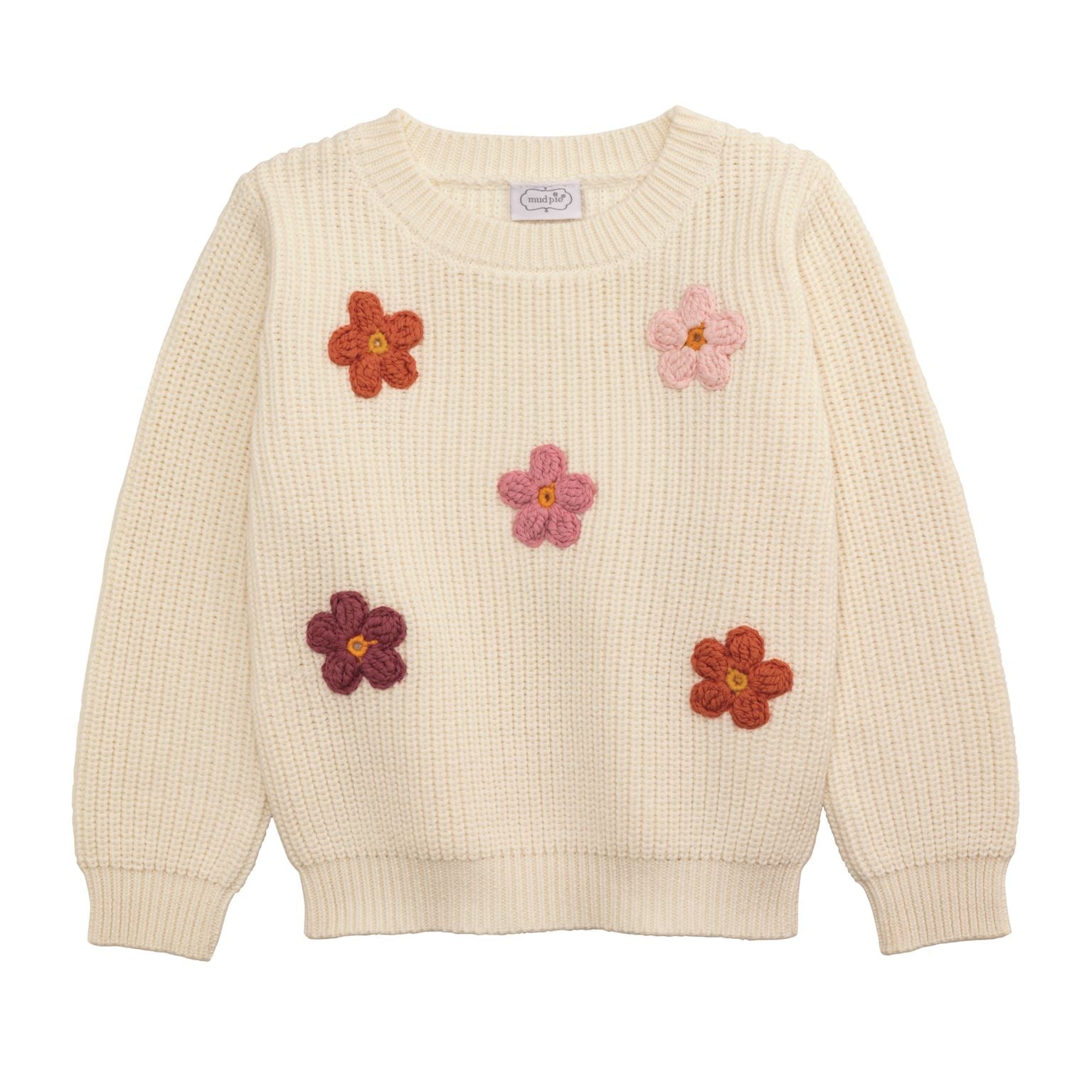 Beige sweater with flower patterns on a white background