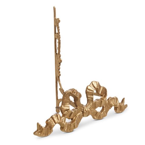 10-inch gold iron easel with decorative bow detail, perfect for displaying plates or frames.