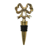 Gold bow wine stopper by Mary Square, elegant bar accessory for holiday entertaining.