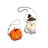 Two Halloween light-up purses, one designed to look like a pumpkin and the other like a ghost, both with black straps and decorative hats.