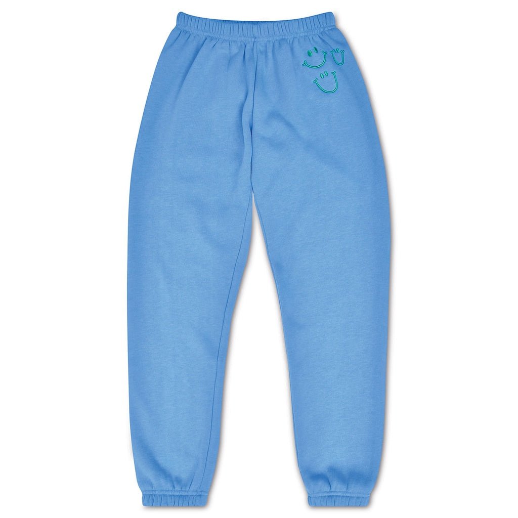 Light blue sweatpants with a smiley face design on a white background