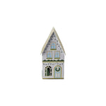 Decorative metal holiday house with festive painted cut-outs