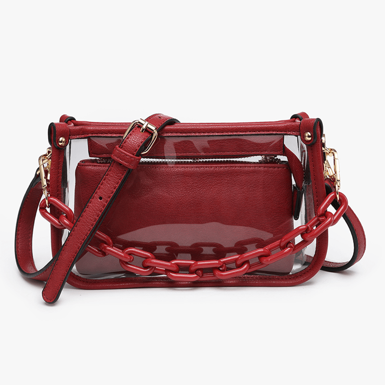 Red handbag with a clear section and chain detail on a white background