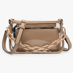 Beige handbag with transparent chain strap on a white background