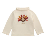 Cream-colored sweater with a turkey design on a white background