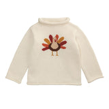Cream-colored sweater with a turkey design on a white background