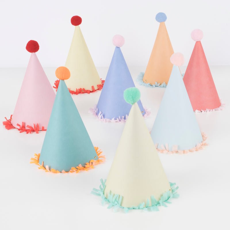 Set of 8 colorful party hats with pom-poms and fringe, perfect for birthdays and celebrations